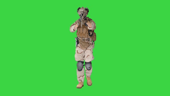 Soldier Walking and Aiming with Assault Rifle on a Green Screen, Chroma Key.