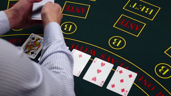 Croupier Deal Cards on Green Table at Casino, Takes Away