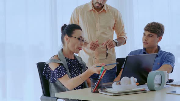 Group Meeting of Creative Business People Designer and Artist at Office Desk