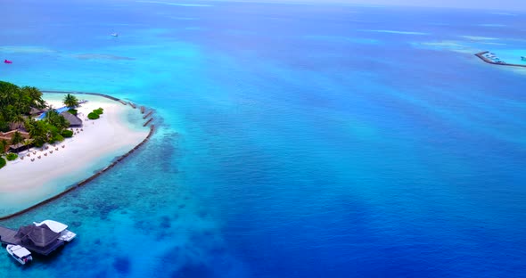 Natural aerial clean view of a white sand paradise beach and blue water background in best quality 4