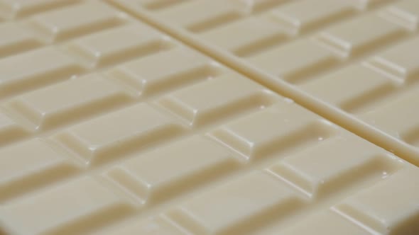 White milk chocolate surface blocks in a row sweet background slow tilt 4K 2160p 30fps UltraHD video