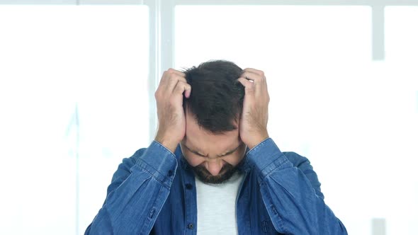 HeadacheStressed Working Man in Office