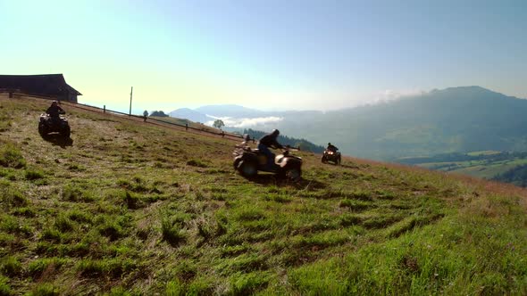 People Riding on Quad Bikes in Carpathian Mountains