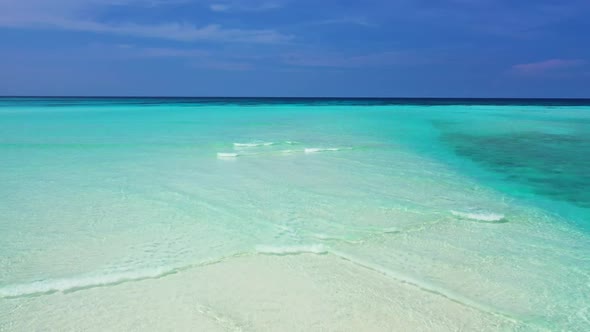 Aerial drone shot travel of idyllic sea view beach wildlife by turquoise lagoon with white sandy bac