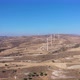 Boundless Fields with Shrubs and Road Against Wind Turbines - VideoHive Item for Sale