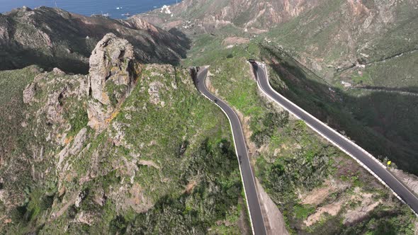 Aerial Drone View of a Wild Touristic Twisty Road in the Green Lush Mountains Along the Atlantic