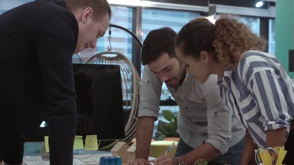 Creative Business People Group Having Conversation at Office Desk in Workplace