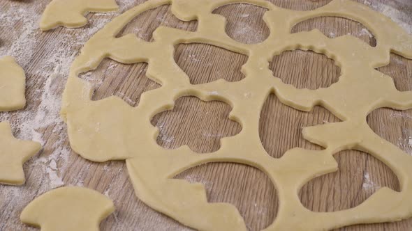 The process of making cookies from shortbread dough.