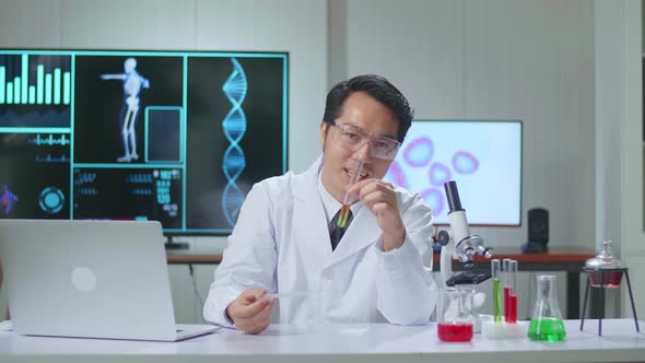 Young Asian Male Research Scientist Talks Into Camera