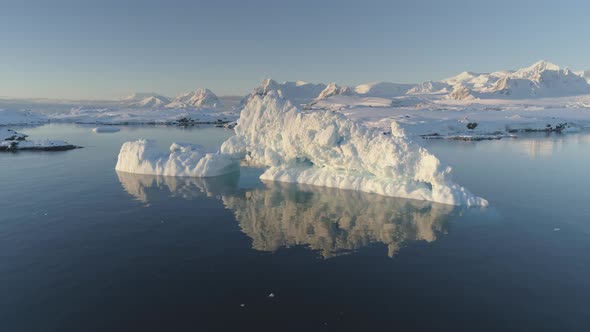 Slow Motion View - Iceberg Melt in Clear Ocean Water.