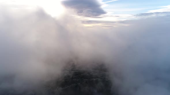 Morning Flight over Beautiful mountains and clouds in the Alps of Austria.