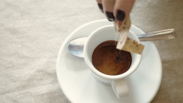 Mixing the Sugar in The Espresso- Close Up