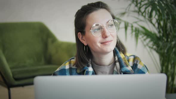 Woman Reading On Laptop