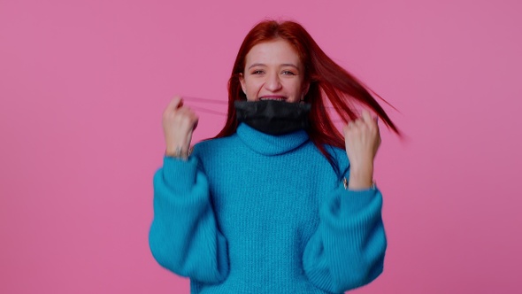 Young Smiling Woman Happily Taking Off Medical Mask and Throws It Away Celebrating Coronavirus End