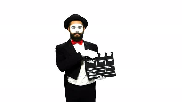 Man Mime Sneezes Using the Movie Clapper on White Background