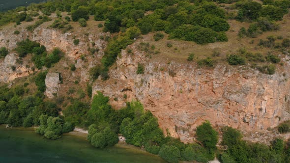 Aerial shot of Macedonia coast. Clif and beautiful water around Ohrid Lake in Southern Europe.