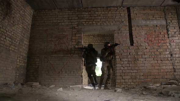 Trained Army Soldier Securing the Rear of Squad alt