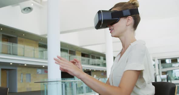 Businesswoman using VR in a modern office