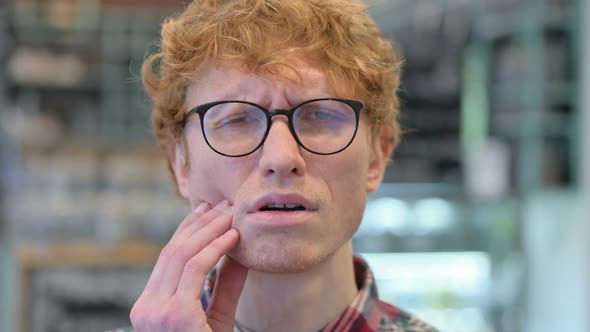 Close Up of Young Redhead Man Having Toothache Cavity