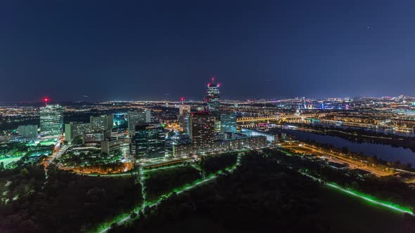 Aerial Panoramic View Over Vienna City with Skyscrapers Historic Buildings and a Riverside Promenade