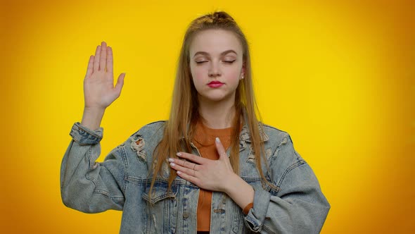 Sincere Responsible Teen Girl Raising Hand to Take Oath Promising to Be Honest and to Tell Truth