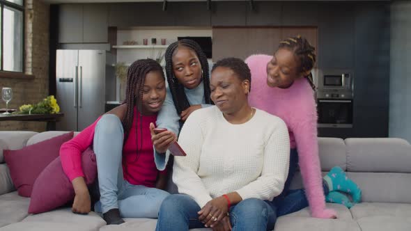 Caring Teenage Sisters Choosing Partner for Mom on Online Dating App