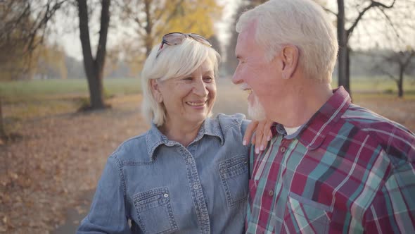 Happy Caucasian Mature Family Looking at Each Other and Smiling