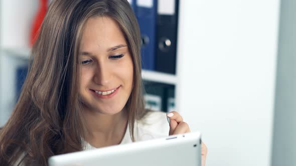 Young Woman Using a Tablet in Office