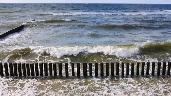 The Waves of the Baltic Sea are Breaking on the Breakwaters Slow Motion