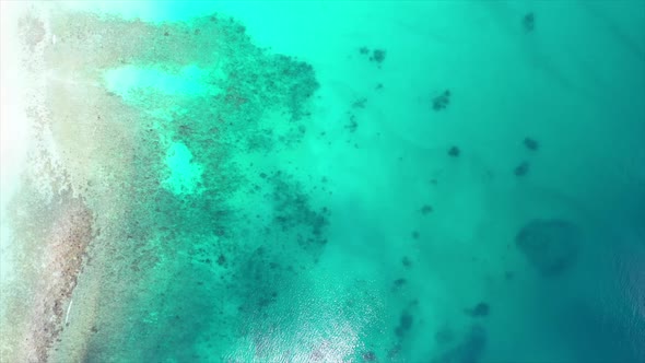 fly over of a dramatic azure seascape off Madagascar