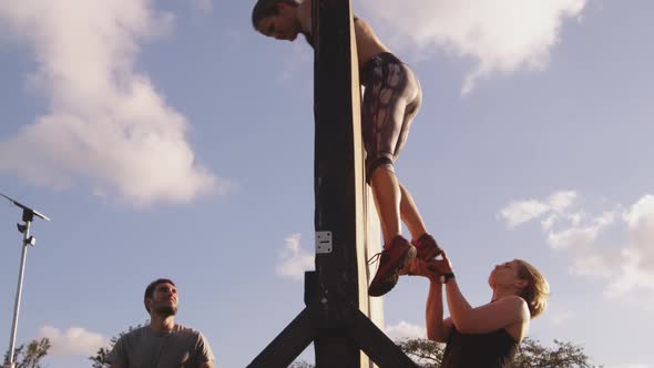 Young adults training at an outdoor gym bootcamp