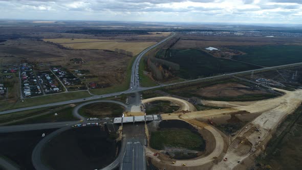 Aerial Unmanned View of the Highway Under Construction. Timelapse of the Construction of the Road