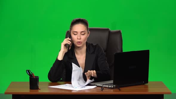 Angry Phone Conversation Between the Girl and Her Subordinate, She Holds Documents in Her Hands