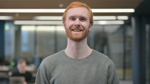 Portrait of Young Man Shaking Head As Yes Sign Approval