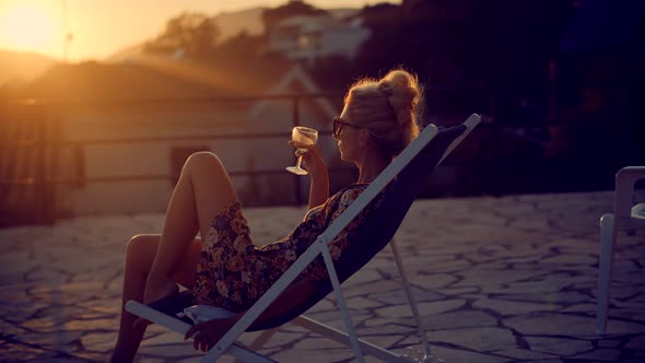 Lady Relaxing Leisure Celebrating Holidays Vacation Sunset.Woman Hold Wineglass And Leisure Drinking