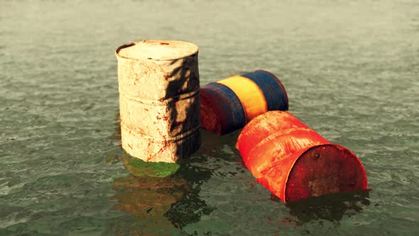 Old Rusty Barrels Oil in Sea Water Illustrates the Pollution of Environment