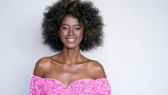 Smiling Black Woman in Pink Dress