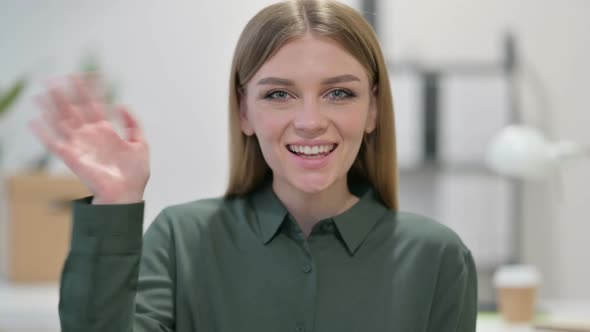 Young Woman Waving Welcoming