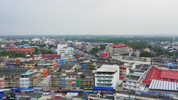 Aerial view of Rom Hoop market. Thai Railway with a local train run through Mae Klong Market