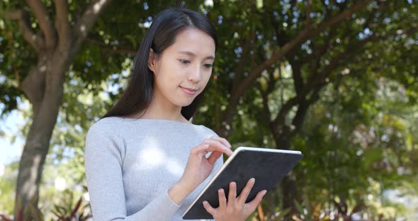 Woman using tablet computer at outdoor