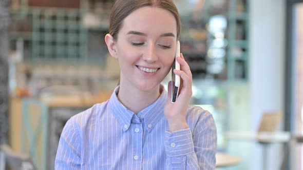 Portrait of Young Businesswoman Talking on Smartphone