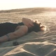 Woman Lying on the Sand at Sunset - VideoHive Item for Sale