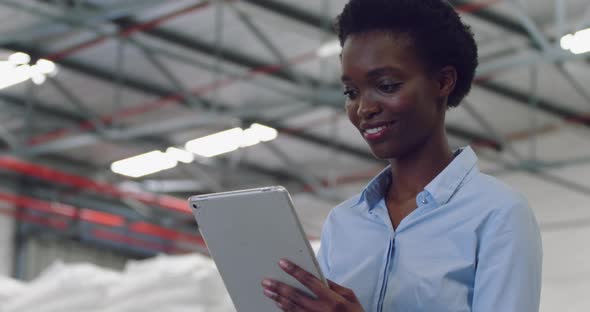 Young female manager in a warehouse