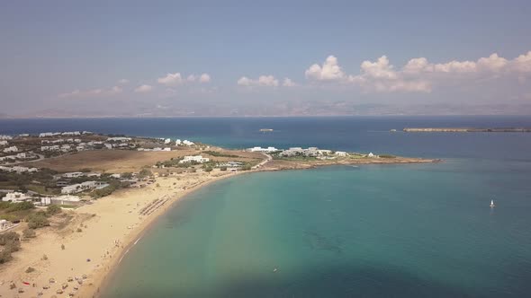 Wide establishing shot of Golden Beach on the greek island of Paros; Aegean Sea; aerial drone.