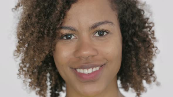 Face Close Up of Happy Young African Woman Smiling at Camera