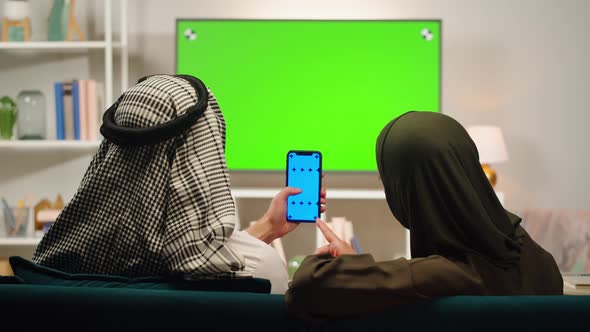 Middle Eastern Family Using Phone with Chroma Key Closeup