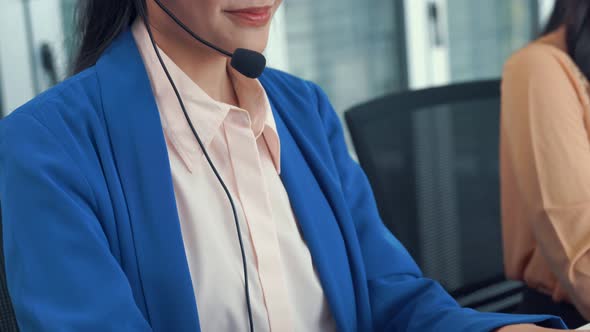 Businesswoman Wearing Headset Working Actively in Office