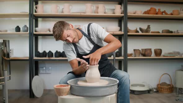 Handicraft the Man Ceramist Makes a Pitcher Out of Clay Handicraft Production of Handmade Tableware