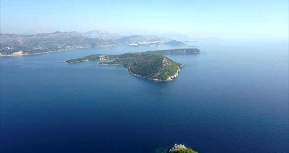 Kolocep Island in Croatia, aerial footage with slow push in. Beautiful blue sea and blue skies