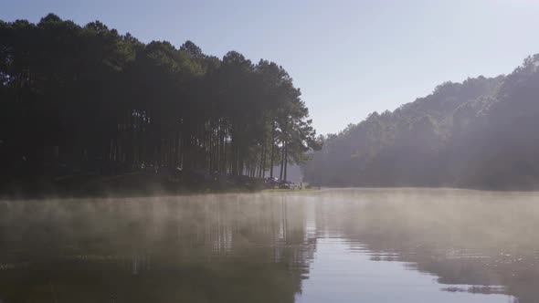 Fog or mist on river lake with forest trees in Pang Ung reservoir, Mae Hong Son, Thailand